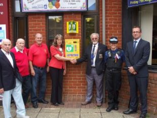 Lions Club members at the Ferndown Barrington Theatre with local representatives after the installation of the defibrillator